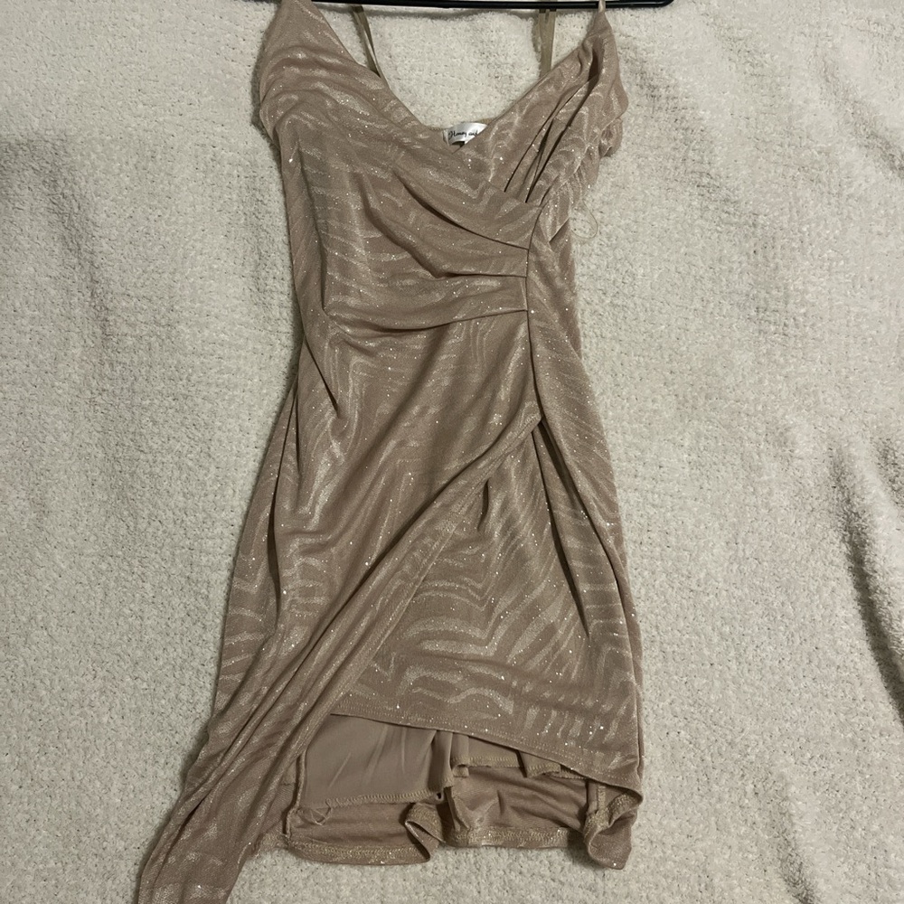 Woman’s gold dress with white stripes